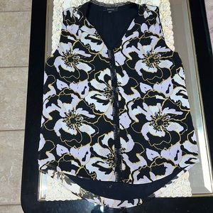 RW&CO black sleeveless blouse with floral print